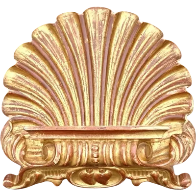A shell-shaped lectern made of carved and gilded wood with rocaille motifs.