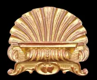 A shell-shaped lectern made of carved and gilded wood with rocaille motifs.