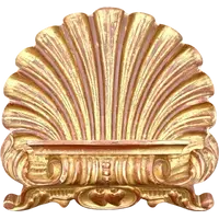 A shell-shaped lectern made of carved and gilded wood with rocaille motifs.