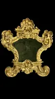 Paire de cartaglories en bois sculpté et feuille d'or
