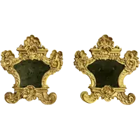 Paire de cartaglories en bois sculpté et feuille d'or