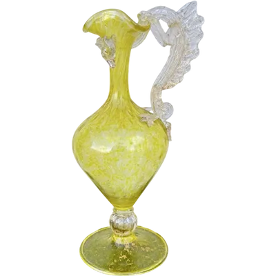 Balloton glass pitcher with a dragon-shaped handle and gold leaf inlay.