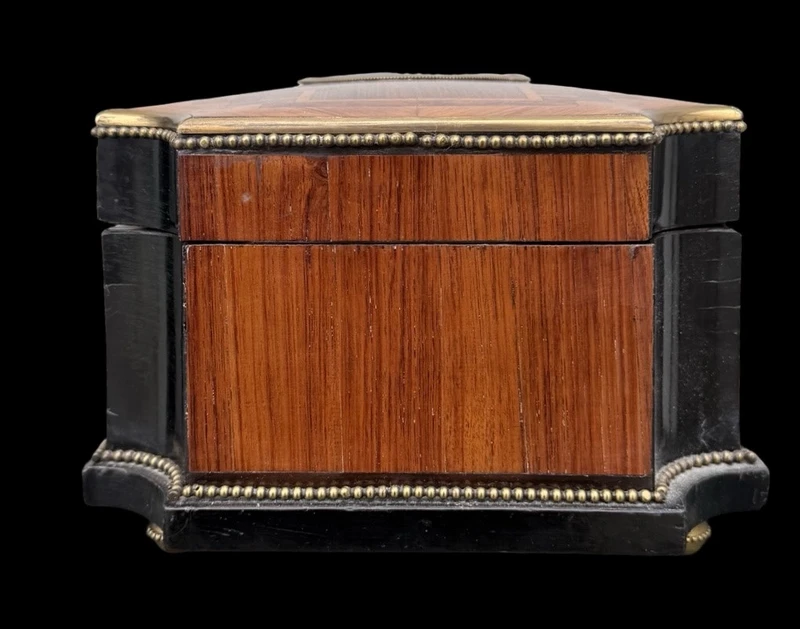 Wooden box inlaid with geometric patterns and a painted porcelain medallion