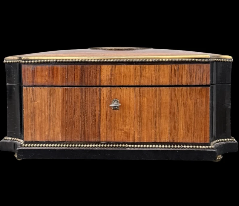 Wooden box inlaid with geometric patterns and a painted porcelain medallion
