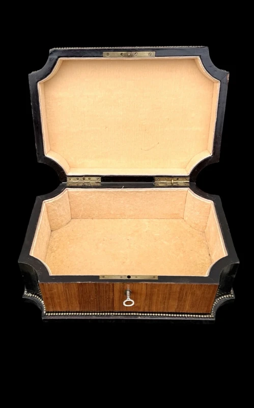 Wooden box inlaid with geometric patterns and a painted porcelain medallion