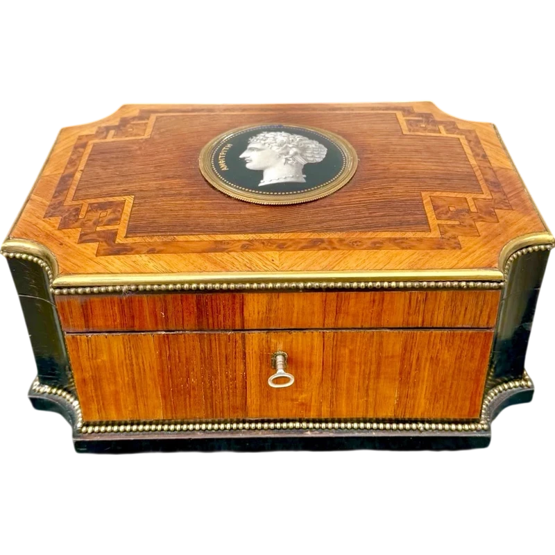 Wooden box inlaid with geometric patterns and a painted porcelain medallion