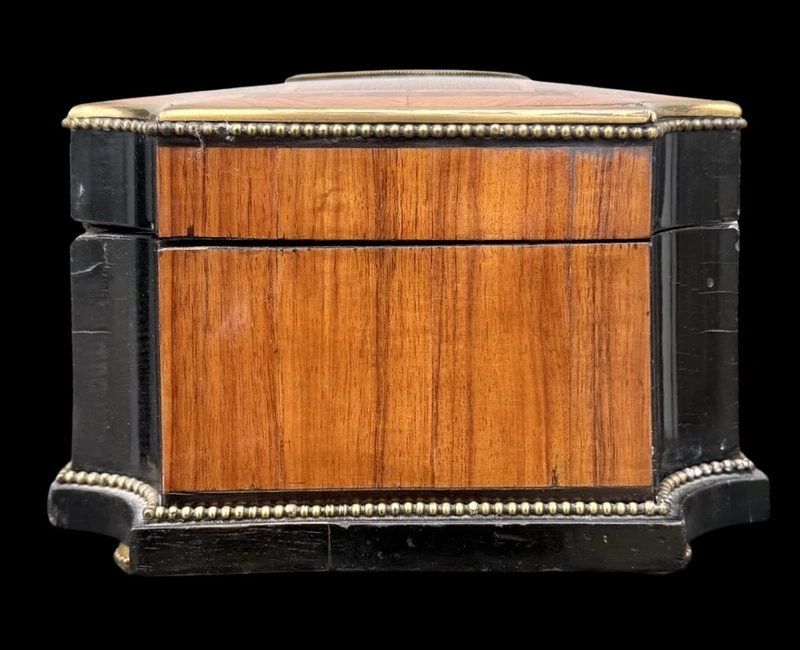 Wooden box inlaid with geometric patterns and a painted porcelain medallion