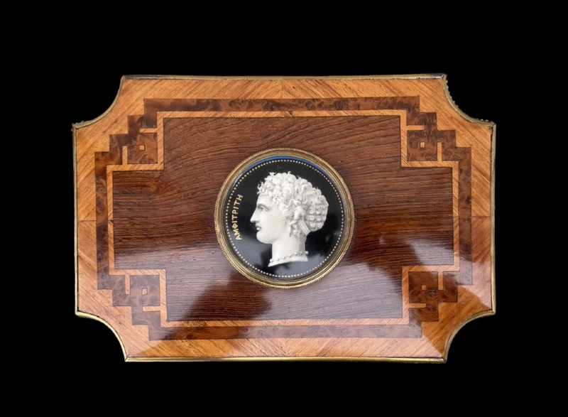 Wooden box inlaid with geometric patterns and a painted porcelain medallion