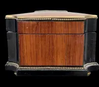 Wooden box inlaid with geometric patterns and a painted porcelain medallion