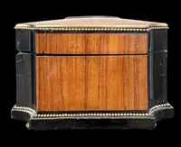 Wooden box inlaid with geometric patterns and a painted porcelain medallion