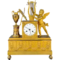 A clock made of mercury-gilded bronze depicting Cupid playing the lyre.