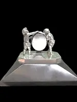 Solid silver paperweight featuring two cherubs holding up a portrait frame