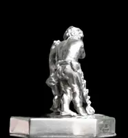 Solid silver paperweight featuring two cherubs holding up a portrait frame