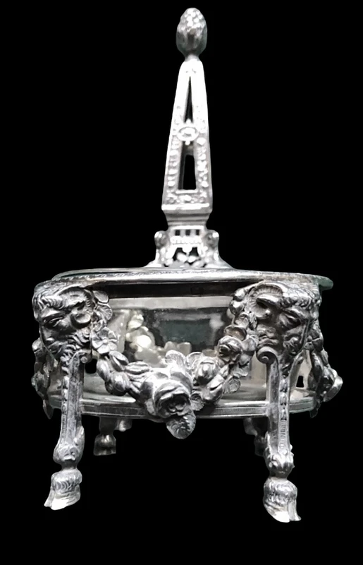 Double salt shaker set made of solid silver with glass compartments.
