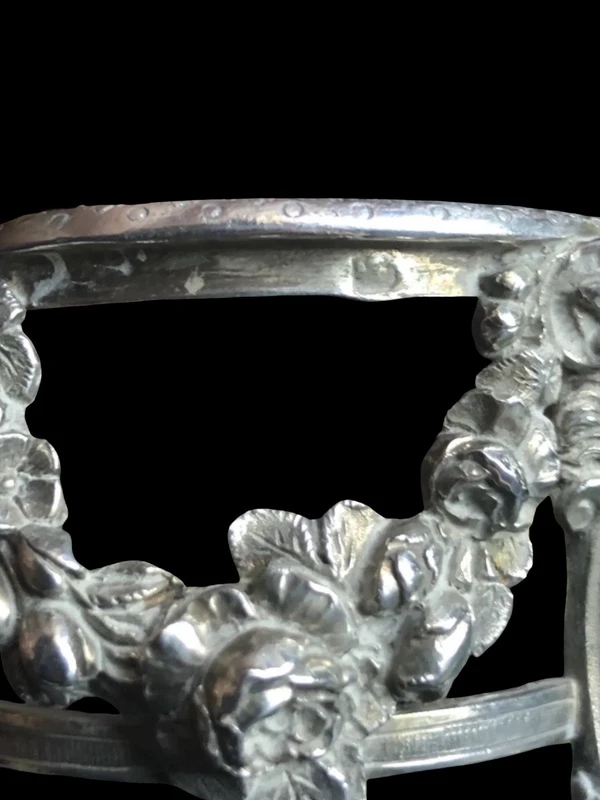 Double salt shaker set made of solid silver with glass compartments.