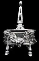 Double salt shaker set made of solid silver with glass compartments.