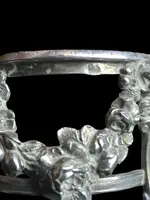 Double salt shaker set made of solid silver with glass compartments.