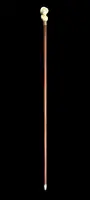 A walking stick with an ivory knob depicting a woman's bust wearing a hat.