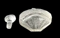 Small octagonal-shaped perfume bottle made of cut crystal