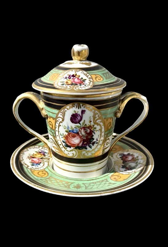 Porcelain maternity mug with floral patterns, geometric motifs, and gold accents.