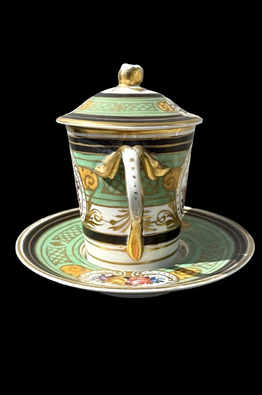 Porcelain maternity mug with floral patterns, geometric motifs, and gold accents.
