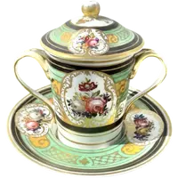 Porcelain maternity mug with floral patterns, geometric motifs, and gold accents.