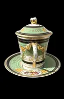 Porcelain maternity mug with floral patterns, geometric motifs, and gold accents.