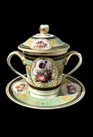 Porcelain maternity mug with floral patterns, geometric motifs, and gold accents.