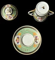 Porcelain maternity mug with floral patterns, geometric motifs, and gold accents.