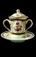 Porcelain maternity mug with floral patterns, geometric motifs, and gold accents.