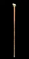 Walking stick with a deer antler knob depicting a cat playing with a ball of yarn.