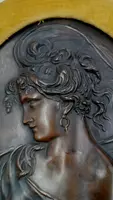 Coppia di sbalzi in bronzo liberty volti femminili