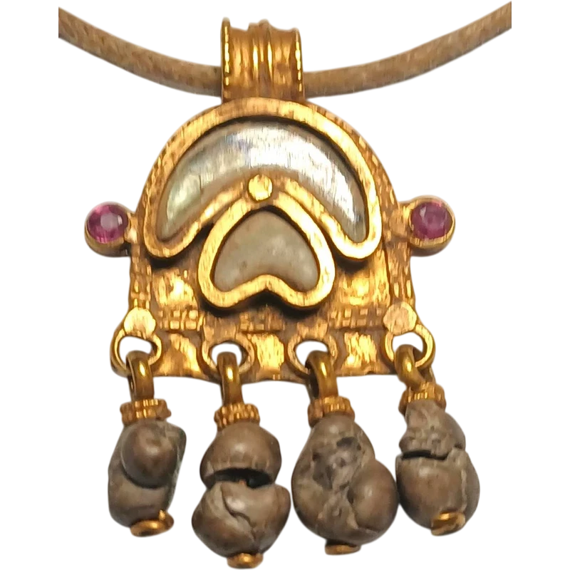 Byzantine magical amulet made of pure gold, rubies, glass paste, and 4 bezoars.