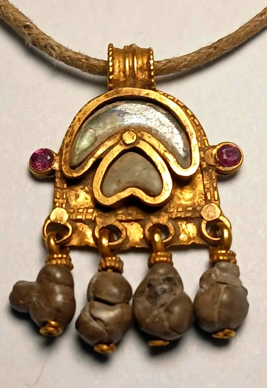 Byzantine magical amulet made of pure gold, rubies, glass paste, and 4 bezoars.