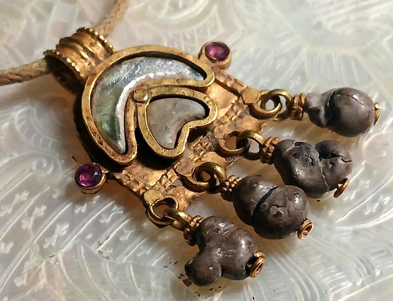 Byzantine magical amulet made of pure gold, rubies, glass paste, and 4 bezoars.