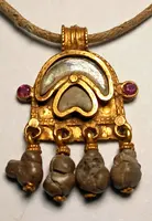 Byzantine magical amulet made of pure gold, rubies, glass paste, and 4 bezoars.