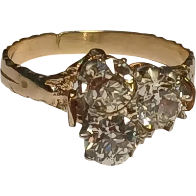 Art Nouveau gold ring with three brilliant-cut diamonds totaling approximately 1.60 kt. White stones in a 19th-century cut.