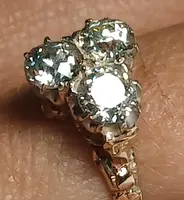 Art Nouveau gold ring with three brilliant-cut diamonds totaling approximately 1.60 kt. White stones in a 19th-century cut.