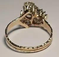 Art Nouveau gold ring with three brilliant-cut diamonds totaling approximately 1.60 kt. White stones in a 19th-century cut.