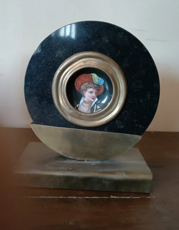Pair of miniatures painted on a marble frame, 1920s, France