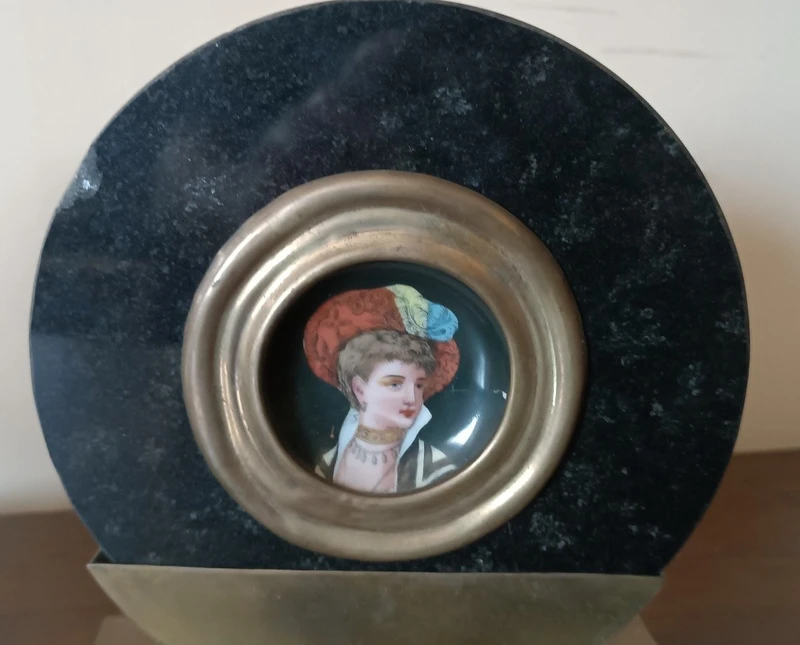 Pair of miniatures painted on a marble frame, 1920s, France
