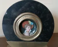 Pair of miniatures painted on a marble frame, 1920s, France