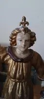A pair of antique angel candlesticks, made of carved, lacquered, and gilded wood