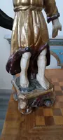 A pair of antique angel candlesticks, made of carved, lacquered, and gilded wood
