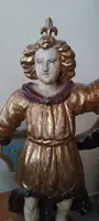 A pair of antique angel candlesticks, made of carved, lacquered, and gilded wood