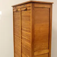 Antique oak filing cabinet with sliding doors