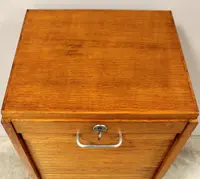 Antique oak filing cabinet with sliding doors