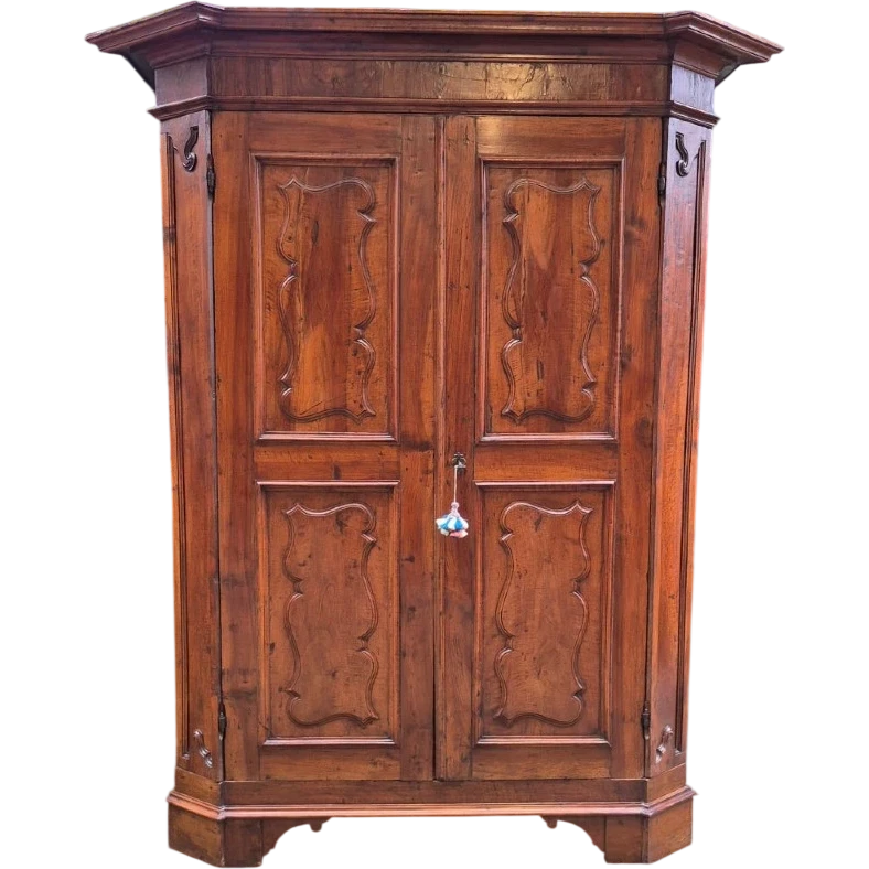 Antique 17th-century wardrobe from Parma, made of paneled and rusticated walnut