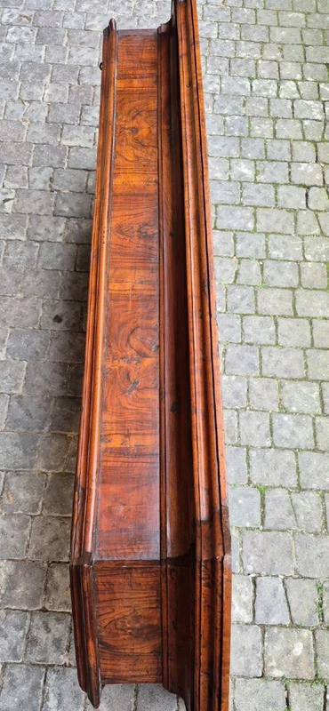 Antique 17th-century wardrobe from Parma, made of paneled and rusticated walnut