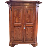 Antique 17th-century wardrobe from Parma, made of paneled and rusticated walnut
